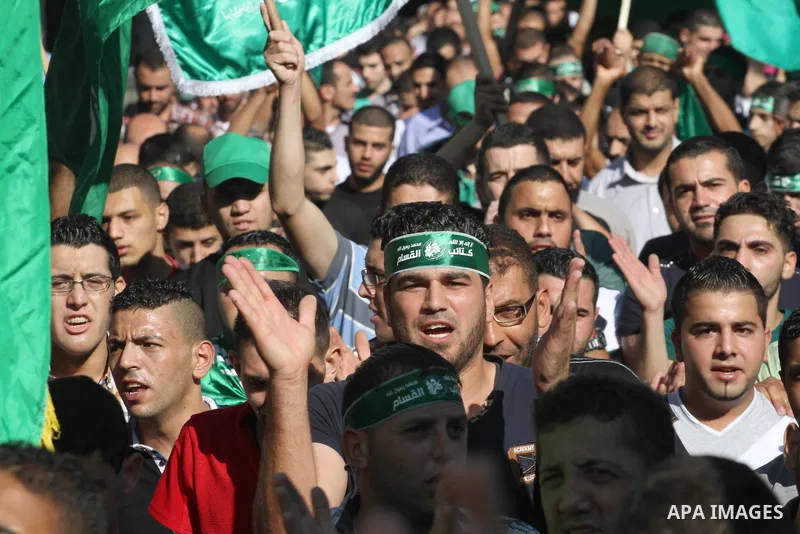 Hamas supporters shout slogans against the Israeli military action in Gaza, during a demonstration in the West Bank city of Nablus, Thursday, July 31, 2014. Photo by Nedal Eshtayah