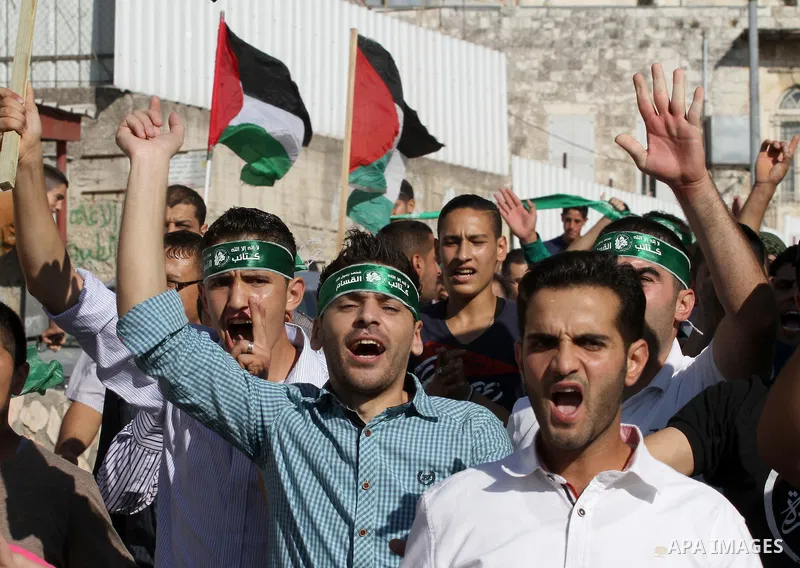 Hamas supporters shout slogans against the Israeli military action in Gaza, during a demonstration in the West Bank city of Nablus, Thursday, July 31, 2014. Photo by Nedal Eshtayah