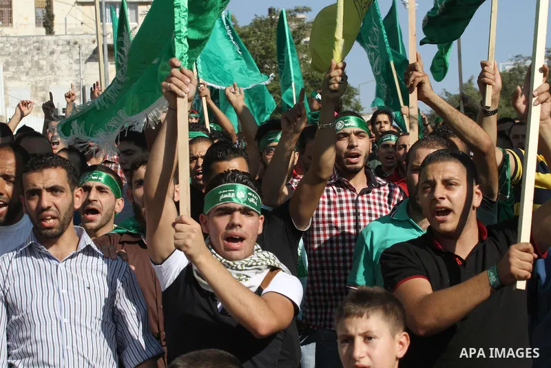 Hamas supporters shout slogans against the Israeli military action in Gaza, during a demonstration in the West Bank city of Nablus, Thursday, July 31, 2014. Photo by Nedal Eshtayah