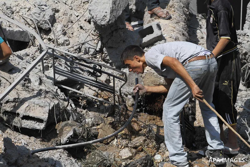 Palestinians walks across the rubble of destroyed buildings and homes in Al-Salam neighbourhood, in Jabalia in the northern Gaza Strip on August 1, 2014. A 72-hour ceasefire took effect today in Gaza but was immediately...
