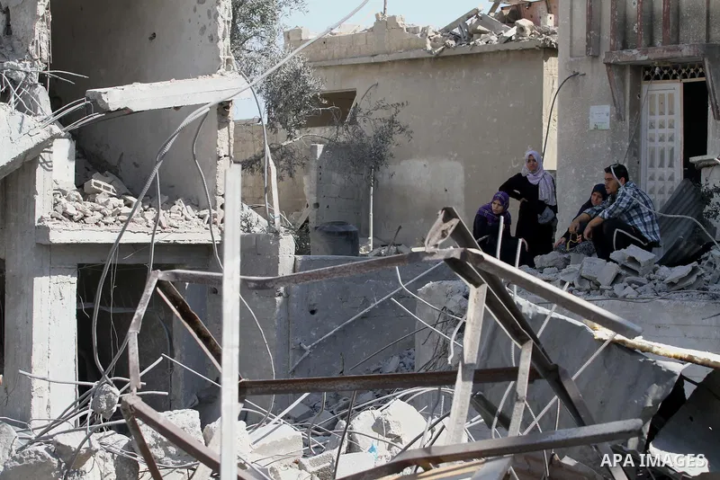 Palestinians walks across the rubble of destroyed buildings and homes in Al-Salam neighbourhood, in Jabalia in the northern Gaza Strip on August 1, 2014. A 72-hour ceasefire took effect today in Gaza but was immediately...