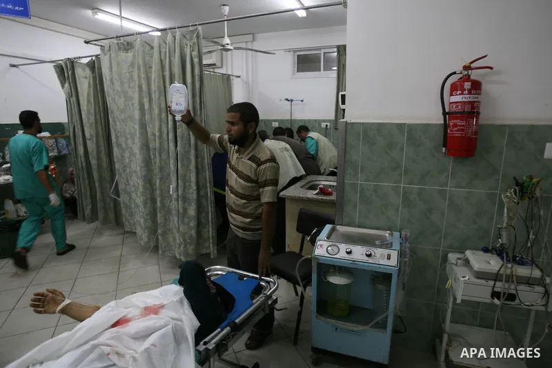 An injured Palestinian woman receives medical treatment at al-Najar hospital in Rafah in the southern of Gaza strip, following an Israeli military strike on August 1, 2014. Egypt told Palestinian officials it is delaying...