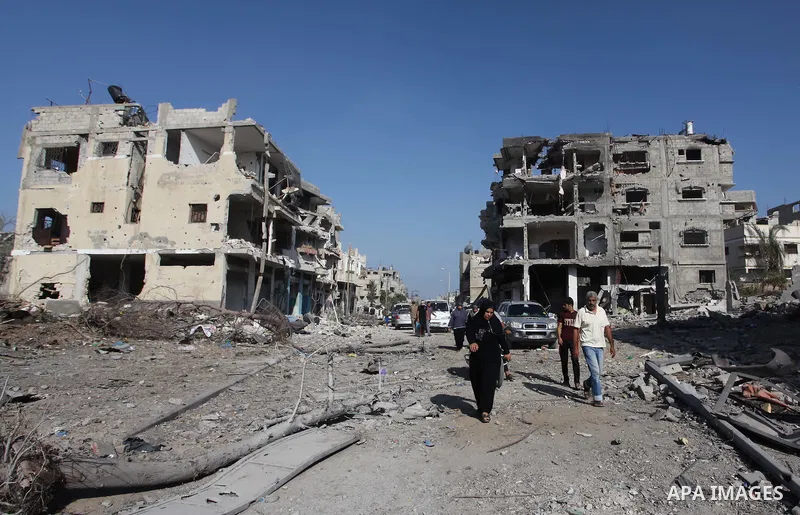 Palestinians who were displaced from their houses due fighting between Israel's army and Hamas fighters return to check their homes in Gaza City's Shejaiya neighbourhood, on August 1, 2014. Israeli shelling killed eight...