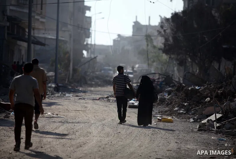 Palestinians who were displaced from their houses due fighting between Israel's army and Hamas fighters return to check their homes in Gaza City's Shejaiya neighbourhood, on August 1, 2014. Israeli shelling killed eight...