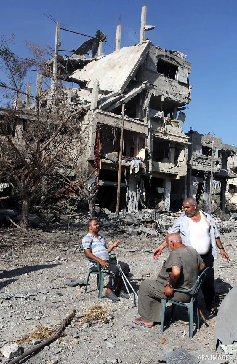 Palestinians who were displaced from their houses due fighting between Israel's army and Hamas fighters return to check their homes in Gaza City's Shejaiya neighbourhood, on August 1, 2014. Israeli shelling killed eight...