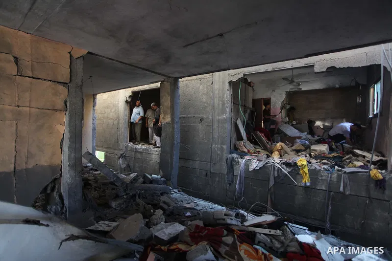 Palestinians inspect the destroyed house, which witnesses said was heavily hit by Israeli air strikes, in Nusseirat in the central Gaza Strip, August 1, 2014. A Gaza ceasefire crumbled only hours after it began on Friday...