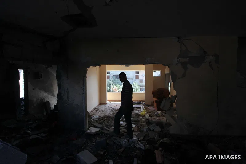 Palestinians inspect the destroyed house, which witnesses said was heavily hit by Israeli air strikes, in Nusseirat in the central Gaza Strip, August 1, 2014. A Gaza ceasefire crumbled only hours after it began on Friday...