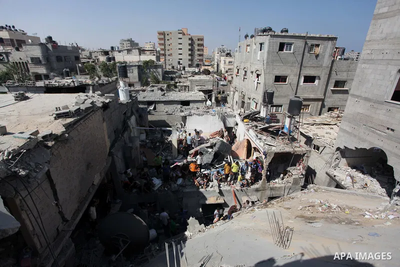 Palestinians inspect the destroyed house, which witnesses said was heavily hit by Israeli air strikes, in Nusseirat in the central Gaza Strip, August 1, 2014. A Gaza ceasefire crumbled only hours after it began on Friday...