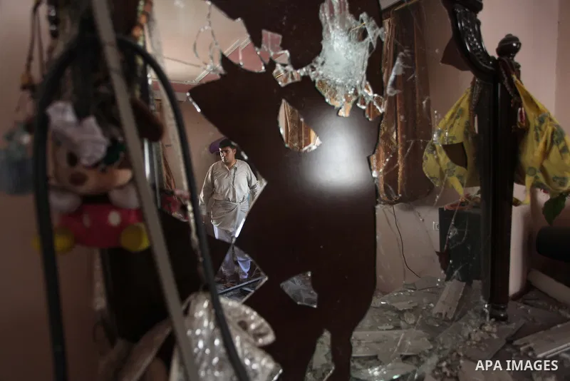 Palestinians inspect the destroyed house, which witnesses said was heavily hit by Israeli air strikes, in the Bureij refugee camp in the central Gaza Strip on Friday, Aug. 01, 2014. A Gaza ceasefire crumbled only hours a...
