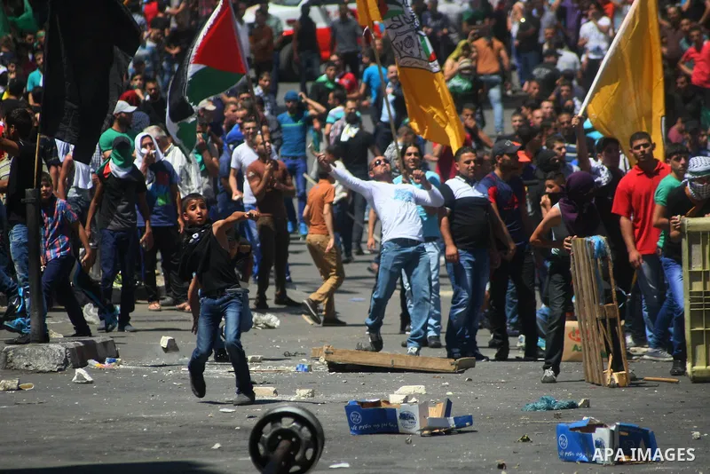 Palestinians turn out to protest in the West Bank city of Hebron, 01 August 2014. Hamas had called for a 'Day of rage' in the West Bank as protests broke out in many places in solidarity with the Hamas movement whose mil...