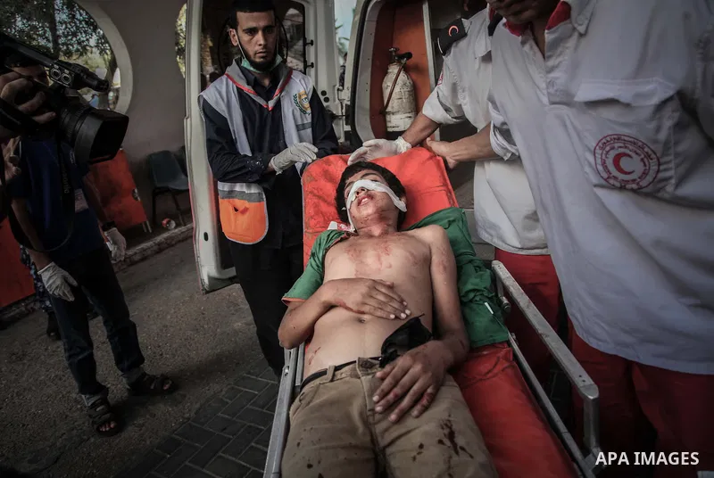 A Palestinian, boy whom medics said was wounded in an Israeli air strike at a hospital in Gaza City July 31, 2014. Israeli Prime Minister Benjamin Netanyahu, facing international alarm over a rising civilian death toll i...