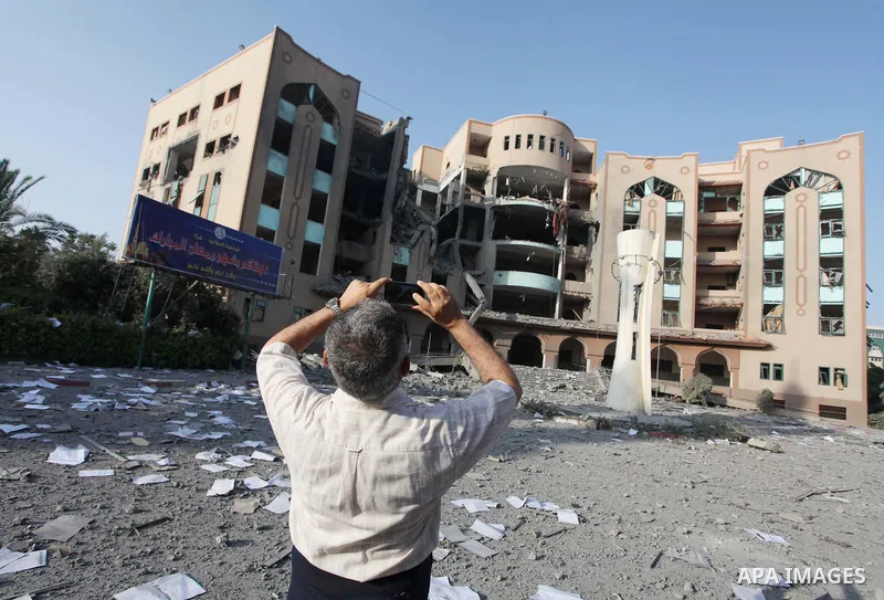 Dr. Kamaleen Shaath, the director of the Islamic University of Gaza inspects the damage at institution in Gaza City on August 2, 2014 after it was hit in an overnight Israeli strike. A fresh wave of violence killed dozen...