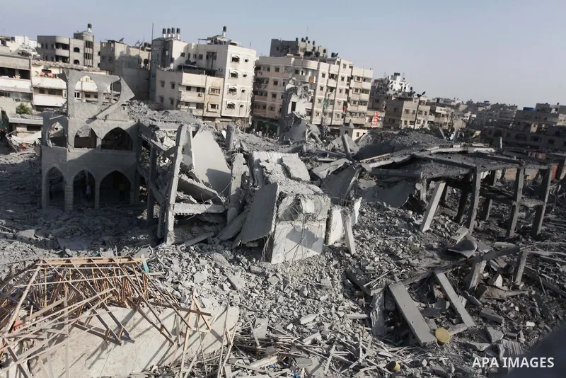 Palestinians inspect the rubble of a destroyed mosque in Gaza City, on August 2, 2014 following an overnight Israeli strike on the Palestinian enclave. A fresh wave of violence killed dozens in Gaza after the collapse of...