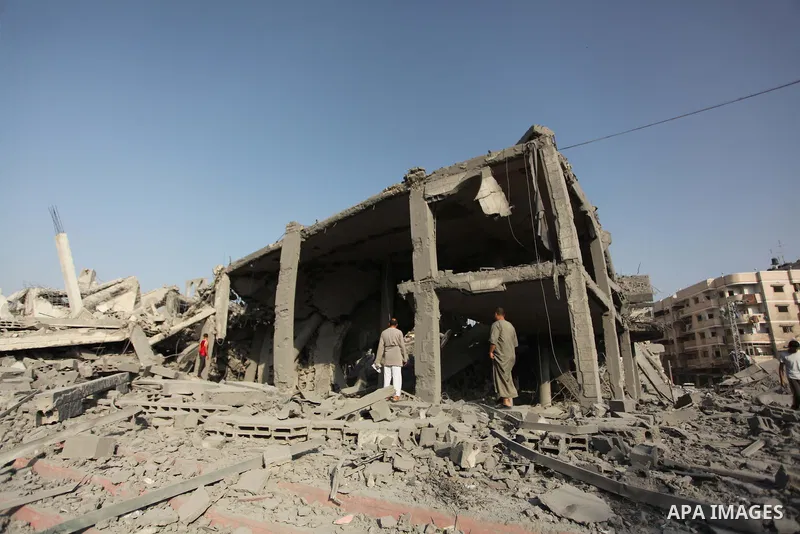 Palestinians inspect the rubble of a destroyed mosque in Gaza City, on August 2, 2014 following an overnight Israeli strike on the Palestinian enclave. A fresh wave of violence killed dozens in Gaza after the collapse of...