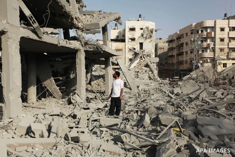 Palestinians inspect the rubble of a destroyed mosque in Gaza City, on August 2, 2014 following an overnight Israeli strike on the Palestinian enclave. A fresh wave of violence killed dozens in Gaza after the collapse of...