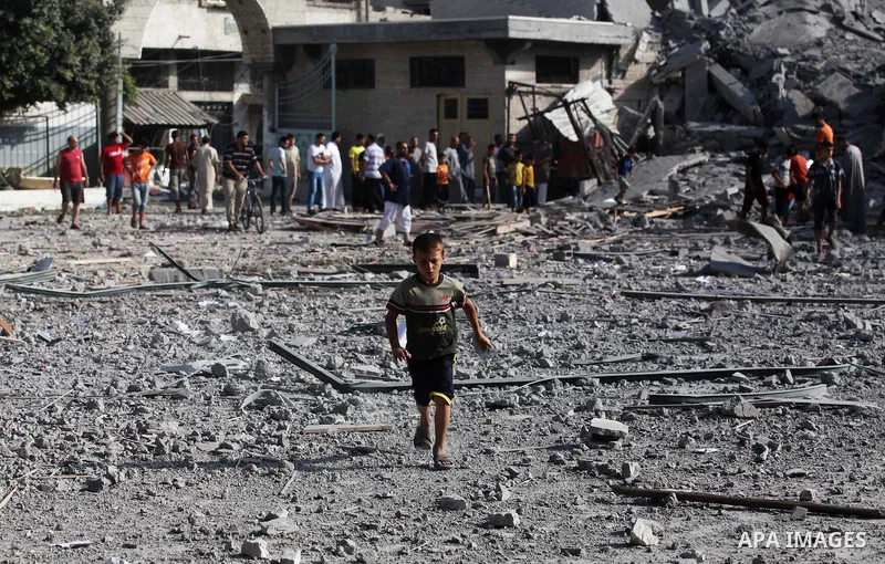 Palestinians inspect the rubble of a destroyed mosque in Gaza City, on August 2, 2014 following an overnight Israeli strike on the Palestinian enclave. A fresh wave of violence killed dozens in Gaza after the collapse of...