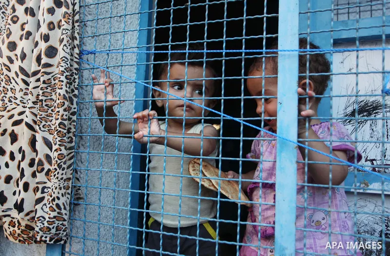 Displaced Palestinians take shelter at the Abu Hussien United Nations school in the Jabalia refugee camp in the northern Gaza Strip on August 2, 2014. The Israeli army gave a first indication it was ending operations in...