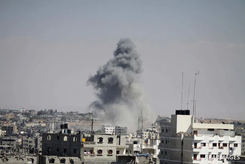 Smoke rises following an Israeli strike in Rafah, in the southern Gaza Strip on August 3, 2014. At least 10 people were killed in a fresh strike on a UN school in southern Gaza which was sheltering Palestinians displaced...