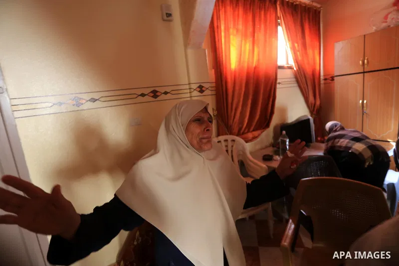 Palestinian relatives mourn on the body of a Palestinian man, Mohammed Shladan, 30, whom medics said was killed in an Israeli air strike on a house, during his funeral in Gaza city August 4, 2014. August 4, 2014. Israel...