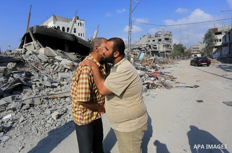 Palestinians inspect destroyed houses as they returning to their homes in the Al-Shejaia neighbourhood of Gaza City on August 5, 2014, after a 72-hour truce agreed by Israel and Hamas went into effect following intense g...