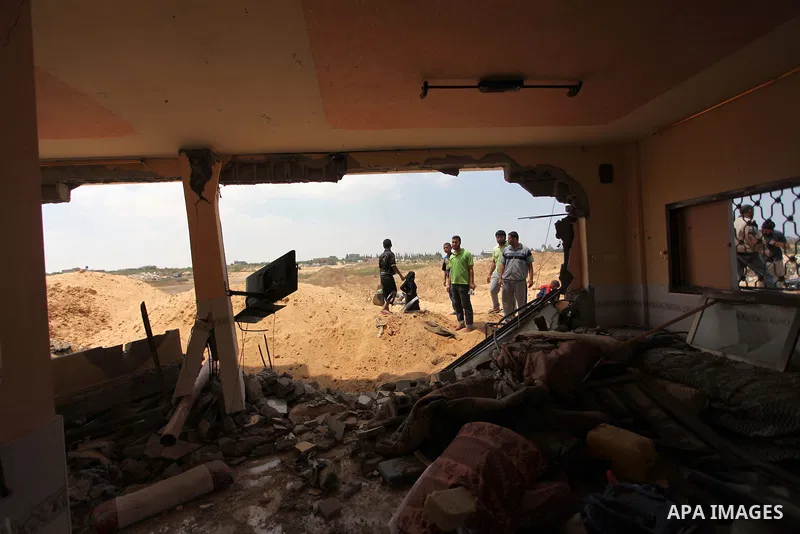 Palestinians inspect their houses, which witnesses said was badly damaged during the Israeli offensive, in the east of Rafah in the southern Gaza Strip August 5, 2014. Israel pulled its ground forces out of the Gaza Stri...