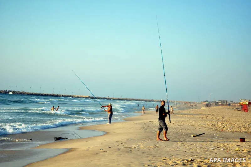 Palestinian children play at the beach on Gaza city, on August 5, 2014. Israel and Hamas began observing a temporary cease-fire on Tuesday that sets the stage for talks in Egypt on a broader deal on the Gaza Strip, inclu...