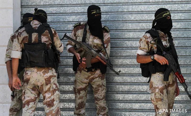 Palestinian members of Al-Quds brigades, the military wing of Palestinian Islamic Jihad (PIJ), attend the funeral of their field commander Shaban Al-Dahdoh in Gaza City, 06 August 2014. For the first time in nearly a mon...