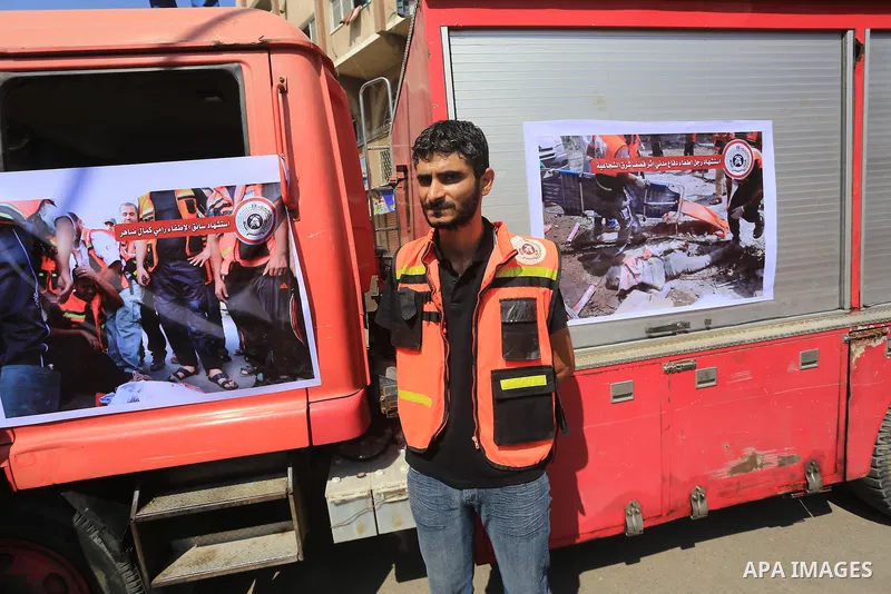 Palestinian members of civil defense take part a protest against the Israeli aggression on them during the war on Gaza Strip, in Gaza city on August 7, 2014. The ceasefire, which came into effect on August 5, has brought...