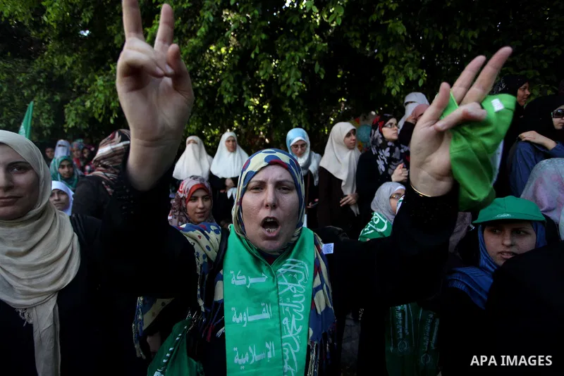 Palestinian protesters take part in a demonstration in support of the negotiator delegation in Cairo and the Palestinian resistance, in Gaza city on August 07, 2014. Indirect Israeli-Palestinian negotiations over extendi...
