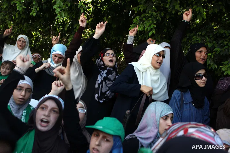 Palestinian protesters take part in a demonstration in support of the negotiator delegation in Cairo and the Palestinian resistance, in Gaza city on August 07, 2014. Indirect Israeli-Palestinian negotiations over extendi...