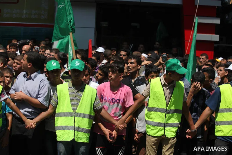 Palestinian protesters take part in a demonstration in support of the negotiator delegation in Cairo and the Palestinian resistance, in Gaza city on August 07, 2014. Indirect Israeli-Palestinian negotiations over extendi...
