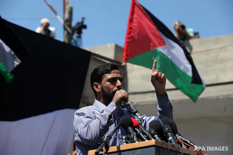 Palestinian Legislative Council member Mushir al-Masri, speaks during a demonstration in support of the negotiator delegation in Cairo and the Palestinian resistance, in Gaza city on August 07, 2014. Indirect Israeli-Pal...