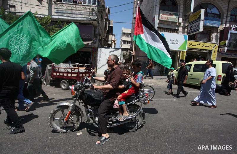 Palestinian protesters take part in a demonstration in support of the negotiator delegation in Cairo and the Palestinian resistance, in Gaza city on August 07, 2014. Indirect Israeli-Palestinian negotiations over extendi...