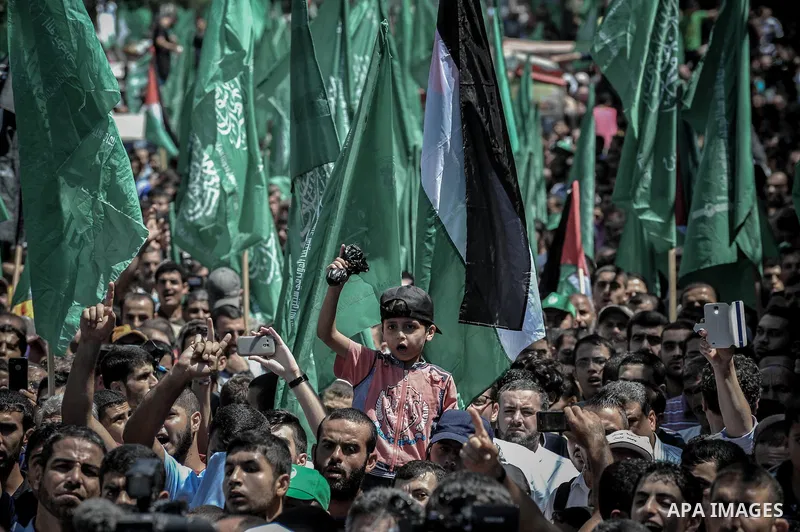 Palestinian demonstrators attend a rally in support of the Hamas movement in downtown Gaza City on August 07, 2014, while diplomatic efforts entered a final countdown in Cairo as Egyptian mediators rushed to broker an ex...