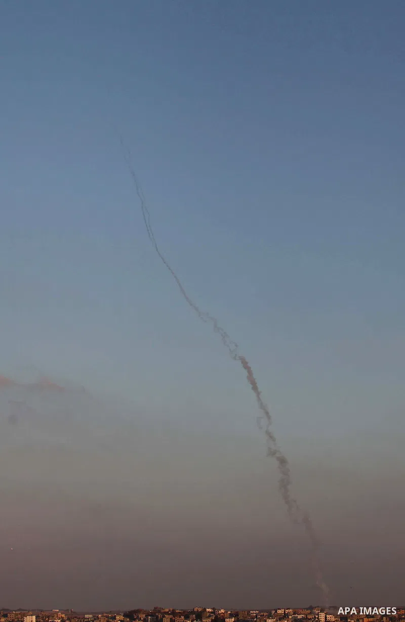 Smoke trails are seen as a rocket is launched from the Gaza city towards Israel on Friday, August 08, 2014. Israel launched air strikes across the Gaza Strip on Friday in response to Palestinian rockets fired after Egypt...