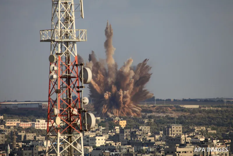 A picture take on August 09, 2014 shows smoke rising as Israeli military forces launch an airstrike on Gaza City. Israel will not engage in talks to end the violence in Gaza while coming under fire, Prime Minister Benjam...