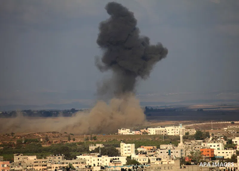 A picture take on August 09, 2014 shows smoke rising as Israeli military forces launch an airstrike on Gaza City. Israel will not engage in talks to end the violence in Gaza while coming under fire, Prime Minister Benjam...