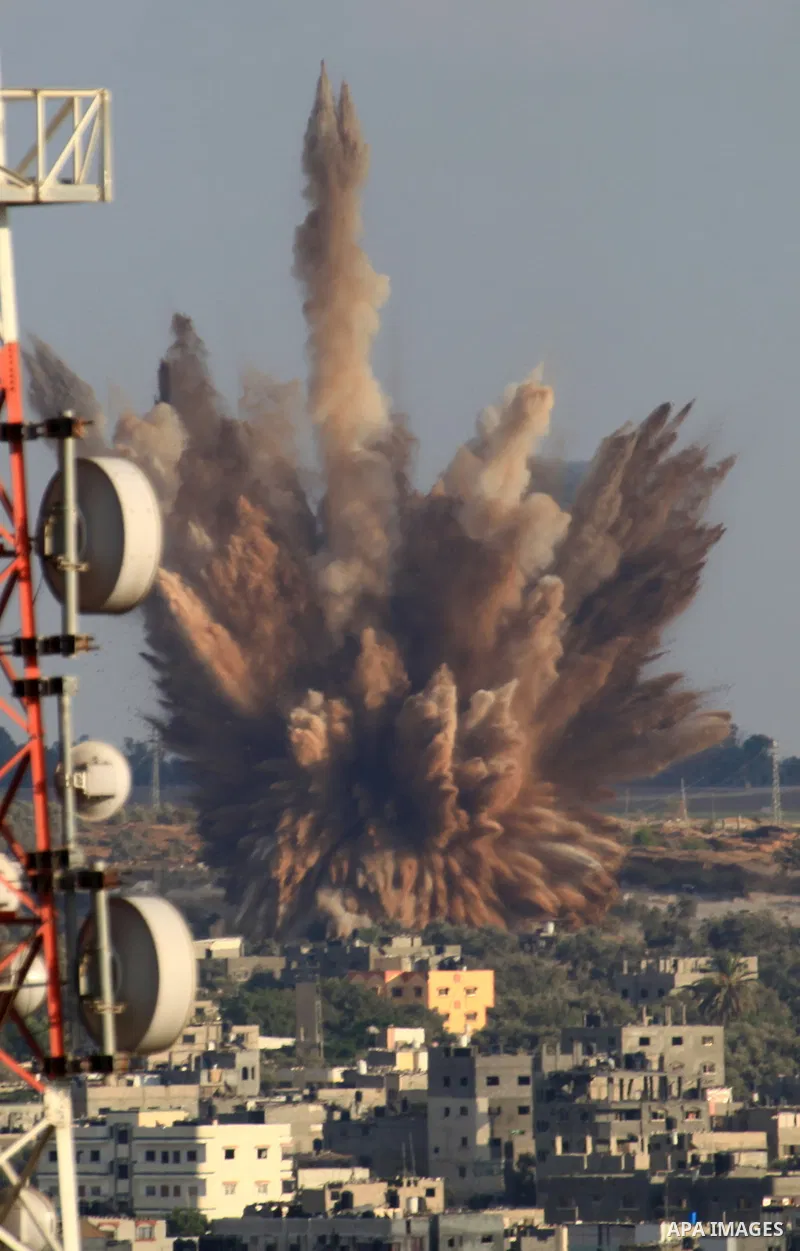 A picture take on August 09, 2014 shows smoke rising as Israeli military forces launch an airstrike on Gaza City. Israel will not engage in talks to end the violence in Gaza while coming under fire, Prime Minister Benjam...
