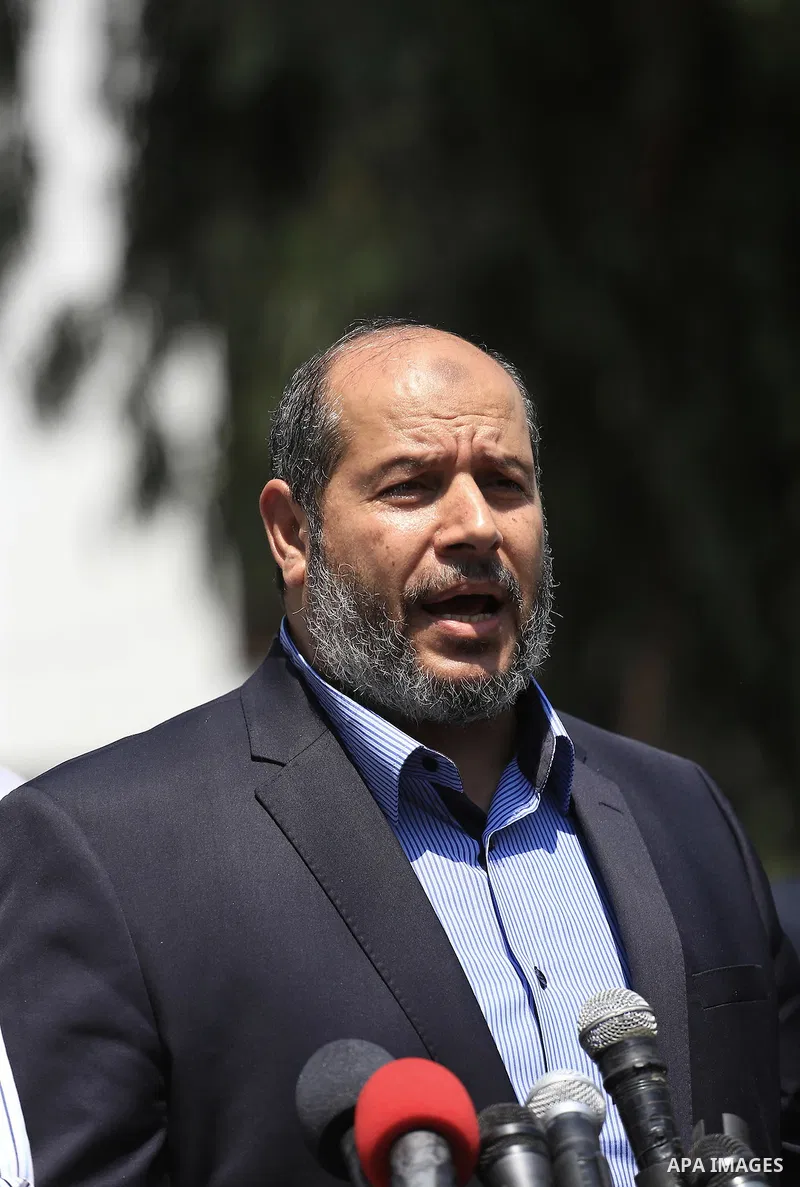 Senior Hamas leader Khalil al-Hayya speaks to the media upon his return to Gaza City from truce talks in Cairo, in Gaza city on August 14, 2014. A renewed truce between Israel and Palestinians appeared to be holding on T...