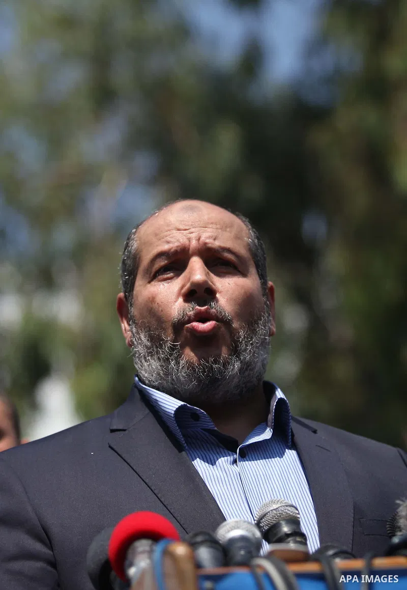 Senior Hamas leader Khalil al-Hayya speaks to the media upon his return to Gaza City from truce talks in Cairo, in Gaza city on August 14, 2014. A renewed truce between Israel and Palestinians appeared to be holding on T...