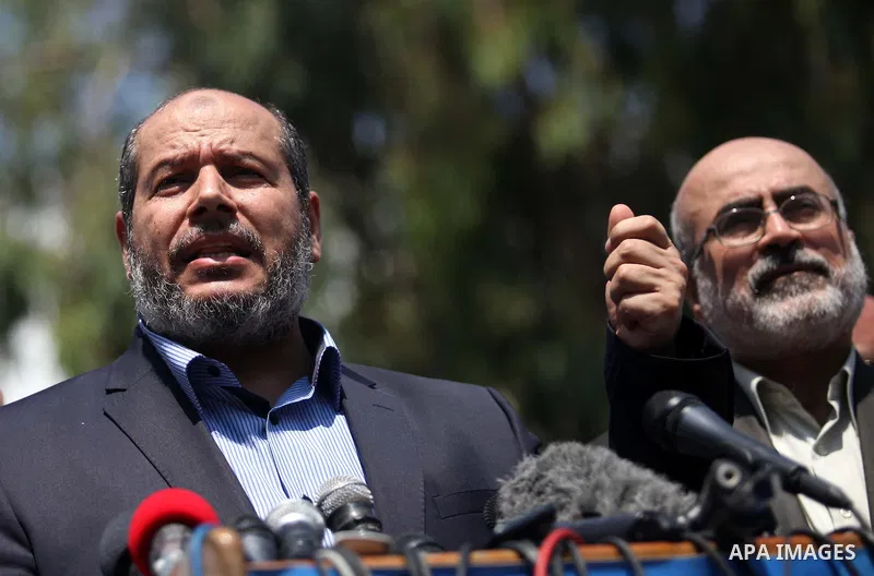 Senior Hamas leader Khalil al-Hayya speaks to the media upon his return to Gaza City from truce talks in Cairo, in Gaza city on August 14, 2014. A renewed truce between Israel and Palestinians appeared to be holding on T...