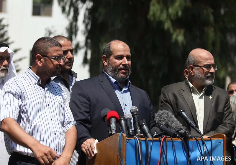 Senior Hamas leader Khalil al-Hayya speaks to the media upon his return to Gaza City from truce talks in Cairo, in Gaza city on August 14, 2014. A renewed truce between Israel and Palestinians appeared to be holding on T...