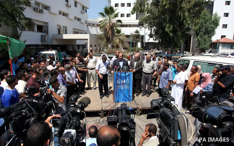 Senior Hamas leader Khalil al-Hayya speaks to the media upon his return to Gaza City from truce talks in Cairo, in Gaza city on August 14, 2014. A renewed truce between Israel and Palestinians appeared to be holding on T...