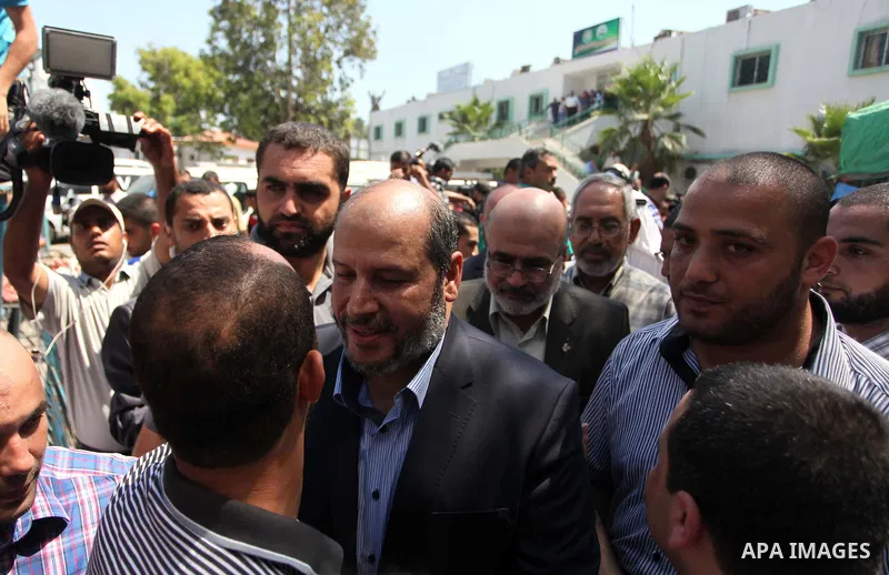 Senior Hamas leader Khalil al-Hayya gets welcome, upon his return to Gaza City from truce talks in Cairo, at al-Shifa hospital in Gaza city on August 14, 2014. A renewed truce between Israel and Palestinians appeared to...