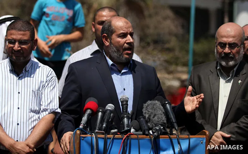 Senior Hamas leader Khalil al-Hayya speaks to the media upon his return to Gaza City from truce talks in Cairo, in Gaza city on August 14, 2014. A renewed truce between Israel and Palestinians appeared to be holding on T...
