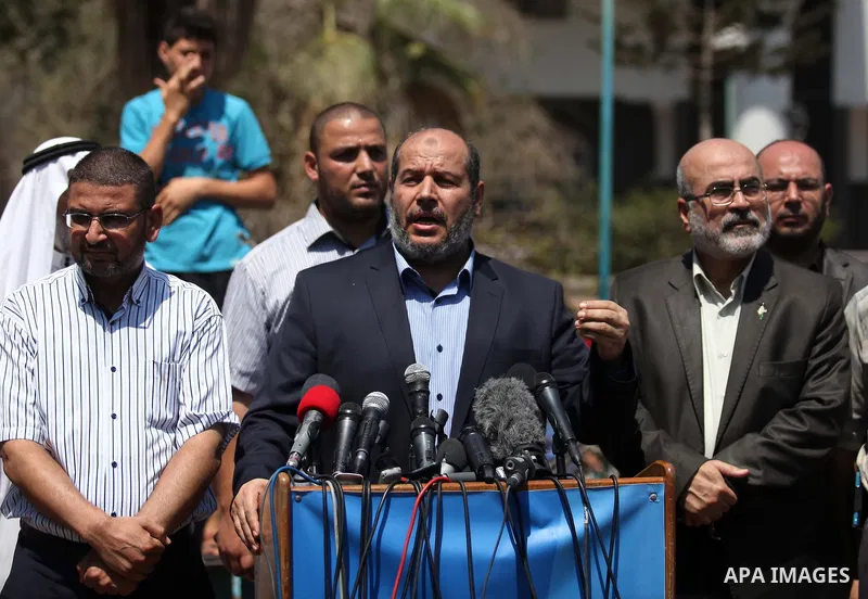 Senior Hamas leader Khalil al-Hayya speaks to the media upon his return to Gaza City from truce talks in Cairo, in Gaza city on August 14, 2014. A renewed truce between Israel and Palestinians appeared to be holding on T...