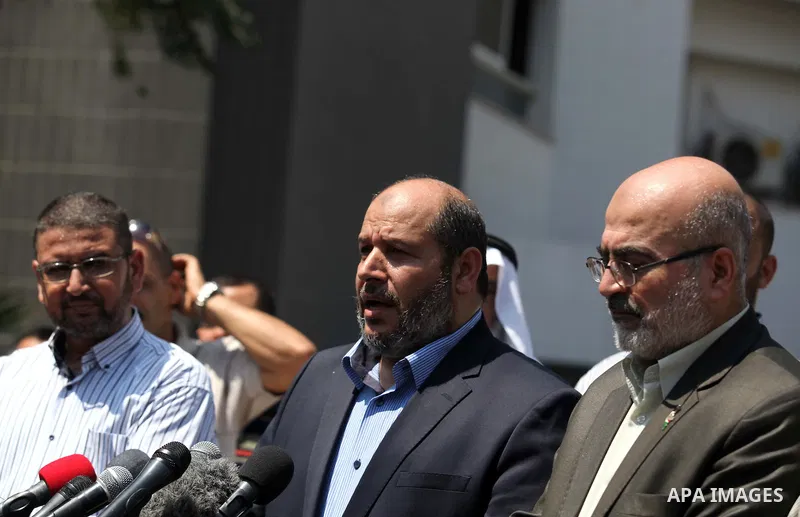 Senior Hamas leader Khalil al-Hayya speaks to the media upon his return to Gaza City from truce talks in Cairo, in Gaza city on August 14, 2014. A renewed truce between Israel and Palestinians appeared to be holding on T...