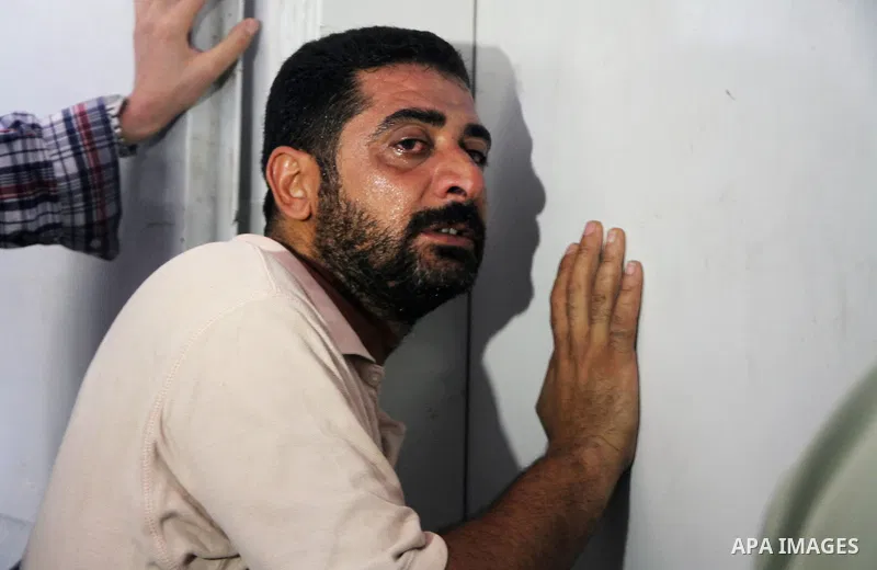 Palestinians mourn the death of their relatives Abu Nahel family's, killed in an Israeli military strike, at Gaza city's Al-Shifa hospital on August 21, 2014. Three senior Hamas commanders and four children were among at...