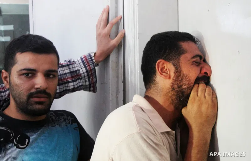 Palestinians mourn the death of their relatives Abu Nahel family's, killed in an Israeli military strike, at Gaza city's Al-Shifa hospital on August 21, 2014. Three senior Hamas commanders and four children were among at...