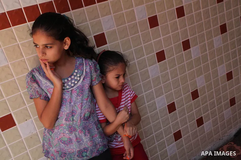 Palestinian relatives of Mohammed Barhoum, one of three senior Hamas commanders who was killed in an Israeli air strike, mourn during his funeral in Rafah in the southern Gaza Strip August 21, 2014. Israel killed three s...